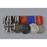 IMPERIAL GERMANY WWI/WWII GROUP OF MEDALS, on a wearing bar, consisting Iron Cross, 2nd Class, 1914,