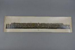 A CARD TUBE CONTAINING A WIDE ANGLE PHOTOGRAPH OF MEMBERS OF THE METROPOLITAN-CAMMELL CARRIAGE &