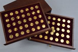 A BOXED SET OF SEVENTY GOLD UPON STERLING SILVER MEDALS, Our Royal sovereigns in original fitted