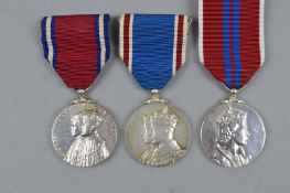 THREE CORONATION MEDALS, all un-named as issued, 1935, George V, 1937, George VI and 1953 ERII,