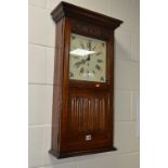 AN OLD CHARM OAK LINEN FOLD WALL CLOCK, with Roman numerals, approximate height 81.5cm