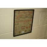 A 19TH CENTURY NEEDLEWORK SAMPLER, cotton on a coarse linen ground, with alphabets, numbers,