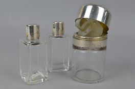 THREE SILVER TOPPED COSMETIC JARS