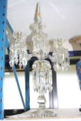 A GLASS CENTRE TABLE LUSTRE CANDELABRA, approximate height 68cm (one arm re-glued, dropper af),
