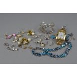 AN ASSORTED JEWELLERY COLLECTION, to include a quantity of gold plated earrings, a gent's gold