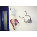 THREE NOVELTY WALL HANGINGS, shaped as a set of horns (covered in wrapping), a paper mache Rhino