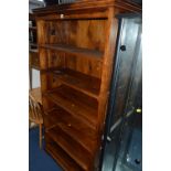 A HARDWOOD OPEN BOOKCASE, approximate size width 92cm x height 78cm x depth 39cm