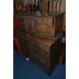 A CARVED OAK COURT CUPBOARD, with two short drawers, approximate size width 122cm x height 140cm x