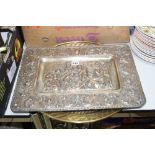 A LATE VICTORIAN SILVER PLATED RECTANGULAR PLAQUE, embossed with a classical scene, together with