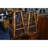 A PAIR OF COUNTRY OAK CIRCULAR TOPPED BAR STOOLS