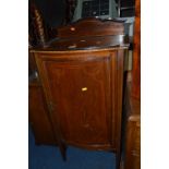 AN EDWARDIAN MAHOGANY AND INLAID SINGLE DOOR CABINET, with a raised back (sd)