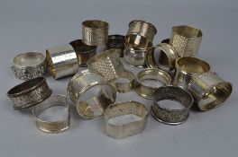 A COLLECTION OF TWENTY SILVER NAPKIN RINGS, approximate weight 495 grams