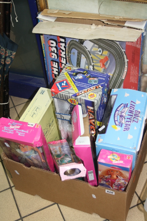 FOUR BARBIE DOLLS, in boxes, a Buz lightyear, a 'Porsche 930 and Maserati Road Racing' set,