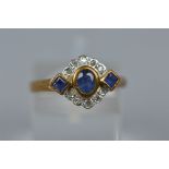 A MODERN 9CT GOLD SAPPHIRE AND DIAMOND DRESS RING, estimated total diamond weight 0.05ct, ring