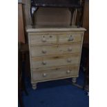 A VICTORIAN STRIPPED PINE CHEST, of two short and three long drawers, on turned feet, approximate