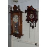 A MODERN MAHOGANY WALL CLOCK (pendulum) and a modern cuckoo clock (2)