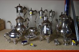 A LARGE COLLECTION OF PLATED WARE, to include water jugs, coffee pots, condiments, etc