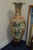 A LARGE REPRODUCTION ORIENTAL VASE, with wavy top edge above a Chinese scene, on a separate hardwood