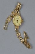 A LADIES 9CT GOLD ACCURIST WRISTWATCH, oval cream dial measuring approximately 19 x 16mm, baton hour