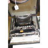 A CASED CORONA TYPEWRITER