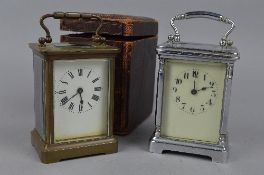 A BRASS CARRIAGE CLOCK, with it's travelling case and another carriage clock