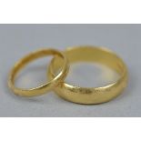 TWO 18CT YELLOW GOLD 'D'SHAPED CROSS SECTION WEDDING BANDS, one measuring approximately 3mm in