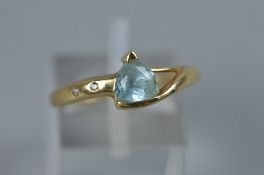 A MODERN 9CT GOLD BLUE TOPAZ AND DIAMOND DRESS RING, ring size P1/2, convention hallmarked 9ct