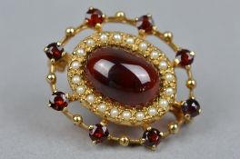 A 9CT GARNET AND SEED PEARL BROOCH, approximate weight 6.7 grams