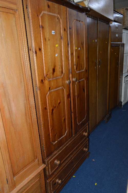 A PINE TWO DOOR WARDROBE, above two long drawers