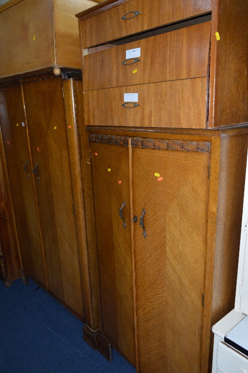 AN OAK THREE PIECE BEDROOM SUITE, comprising of two wardrobes and a dressing table, together with