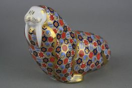 A ROYAL CROWN DERBY 'WALRUS' PAPERWEIGHT, gold stopper