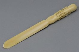 A LATE VICTORIAN IVORY PAPER KNIFE, handled carved as rope and tasssels
