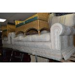 A CREAM UPHOLSTERED TWO PIECE LOUNGE SUITE