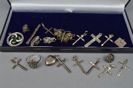 A TRAY OF MIXED SILVER CROSSES, rings, brooches, etc