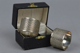 A BOXED PAIR OF SILVER NAPKIN RINGS
