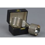 A BOXED PAIR OF SILVER NAPKIN RINGS