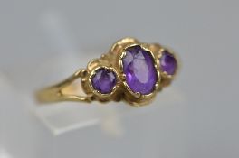 A 9CT AMETHYST THREE STONE RING, ring size L, approximate weight 2.0 grams