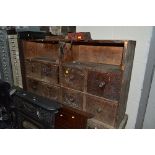 A VINTAGE MULTI DRAWER CABINET, converted to a workbench with two vices attached, eight drawers with