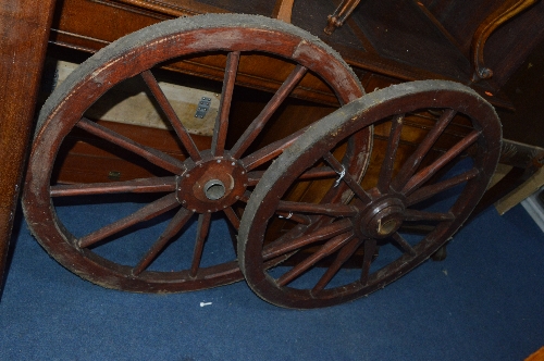 A PAIR OF STAINED PINE CART WHEELS, approximate diameter 80.5cm