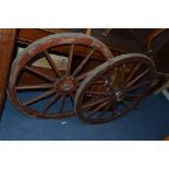 A PAIR OF STAINED PINE CART WHEELS, approximate diameter 80.5cm