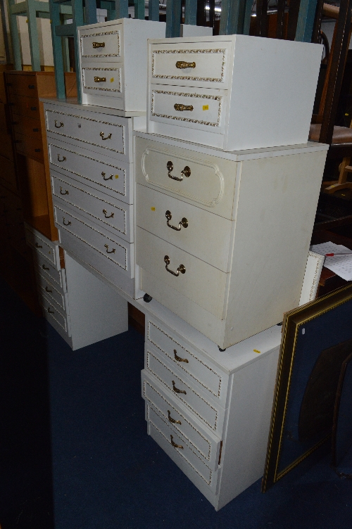 FOUR PIECES OF CREAM AND GILT BEDROOM FURNITURE, comprising of a dressing table, chest of drawers,