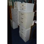 FOUR PIECES OF CREAM AND GILT BEDROOM FURNITURE, comprising of a dressing table, chest of drawers,
