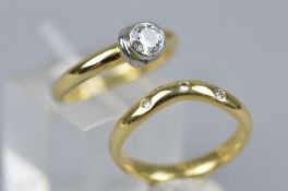 A MODERN 18CT GOLD DIAMOND SINGLE STONE RING, a round brilliant cut diamond rub-over set,