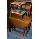 AN OAK BARLEY TWIST GATE LEG TABLE, and two footstools (3)