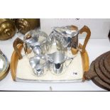 A PICQUOT WARE FOUR PIECE TEA SET ON TRAY