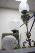 A SILVER PLATED OIL LAMP, height approximately 58.5cm not including shade and funnel, together