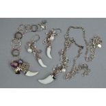A SUITE OF SILVER AND COSTUME JEWELLERY IN THE SHAPE OF TOOTHS, including necklace, bracelet and a