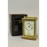 A BRASS CARRIAGE CLOCK (NO KEY) WITH TRAVELLING CASE