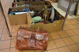 A LEATHER HOLDALL AND A BOX OF SUNDRIES, to include red telephone, brass Bessons & Co cornet (no