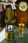 A HAILWOOD & ACKROYD LIMITED MINERS LAMP, together with a smaller example (2)